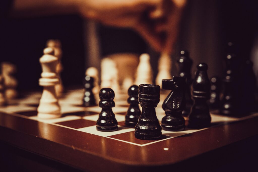 Close-up of a chessboard showcasing strategy, tactics, and focus in a competitive game.